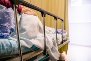 A woman lying in a hospital bed