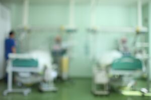 Patients lay in a critical care ward in a hospital. 