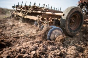 An image shows farm machinery in a field. 