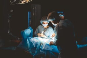 A team of doctors perform surgery on a patient. 