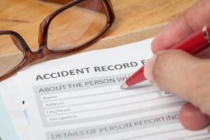 An injured employee filling out an accident report