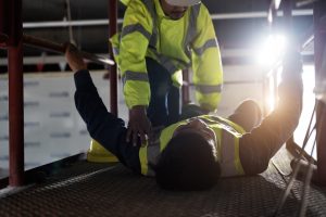 Man lying on floor after accident occured.