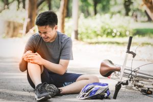 A man who's injured in a cycling accident and would need a bicycle accident lawyer.